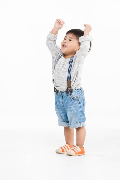 istock Asian kid on isolated background 1153596735