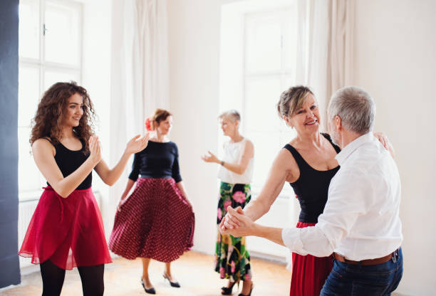 istock Group of senior people in dancing class with dance teacher. 1153605938