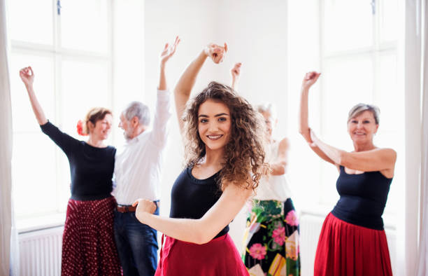 istock Group of senior people in dancing class with dance teacher. 1153605954