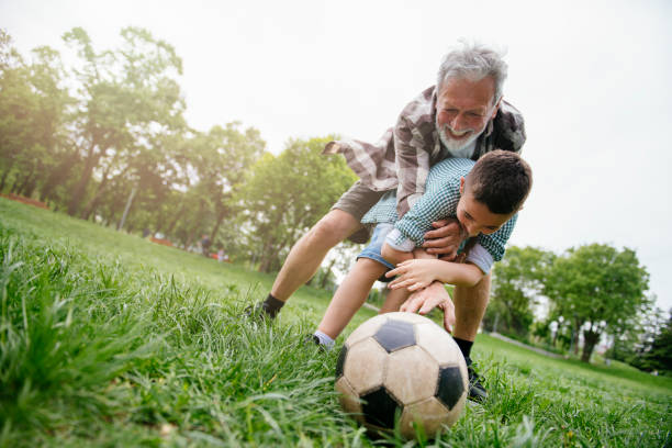 istock Playing Football With Grandad 1153606230