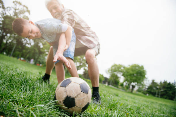 istock Playing Football With Grandad 1153606304