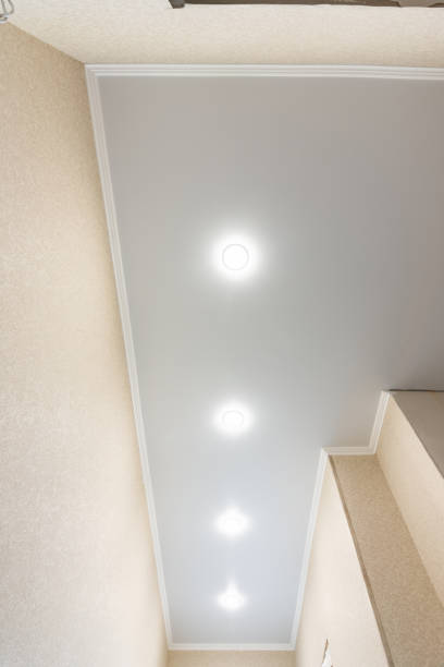 istock Fragment of a stretch ceiling in a long narrow corridor 1153606500
