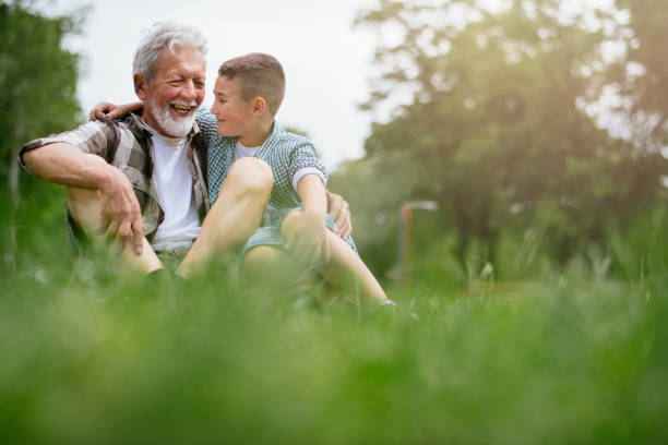 istock Grandfather and grandson enjoy a game 1153606612