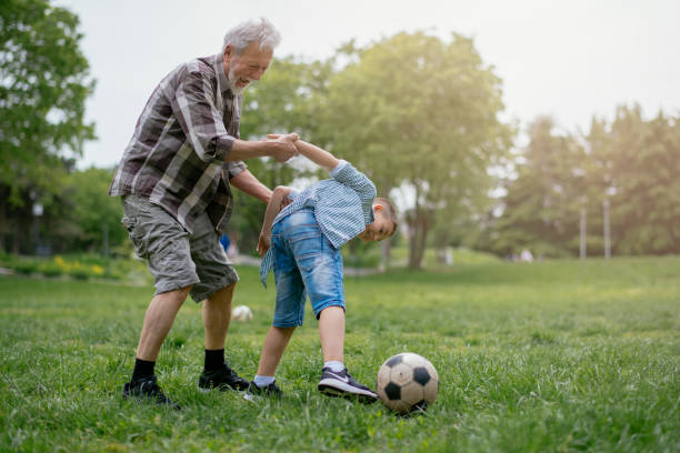 istock Playing Football With Grandad 1153607527