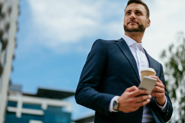 istock Business man using his cell phone 1153608114