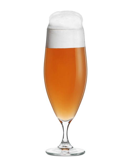 istock Glass of beer with foam falling to the left 1153609368