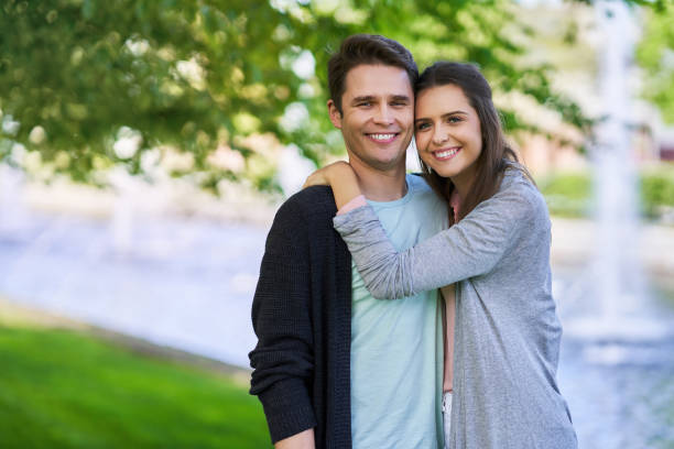 istock Young couple strolling in the park 1153610041