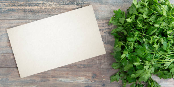 istock Organic parsley closeup on rustic wooden table with a copy space 1153610059