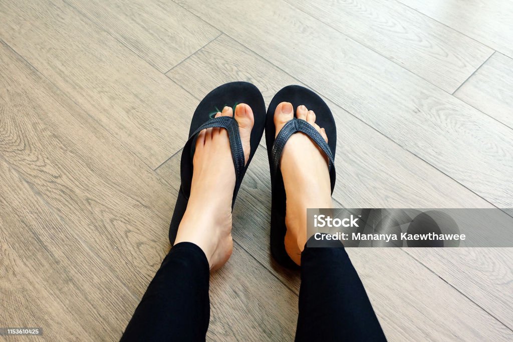 Black Flip Flops Isolated For Fashionable Close Up Of Legs Woman