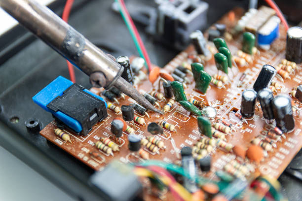 soldering iron for repairing electronic of the computer circuit board concept technology of computer circuit hardware\