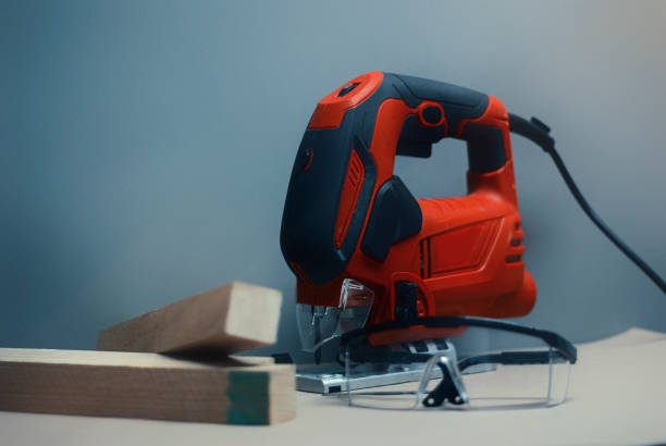 istock Electric jig saw machine on the background gray wall. 1153613105