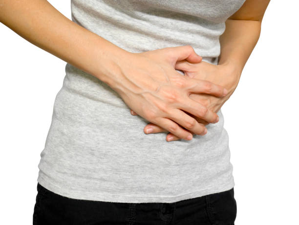 istock Woman suffering from stomach ache 1153616928