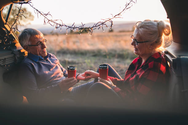 istock Senior couple outdoors with car 1153617821