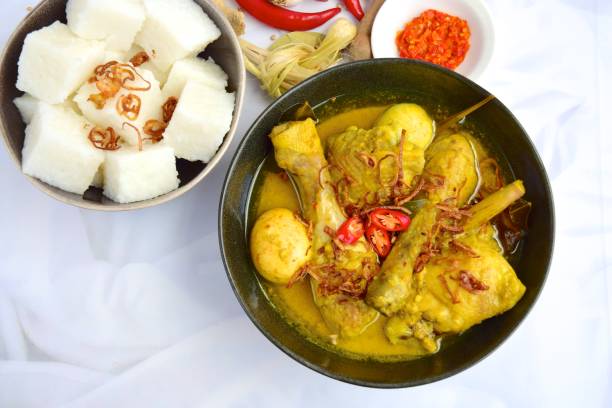istock Opor ayam, chicken cooked in coconut milk and spices. Traditional food from Central Java, Indonesia. Served with lontong and sambal. Popular dish for lebaran or Idul Fitri 1153619830