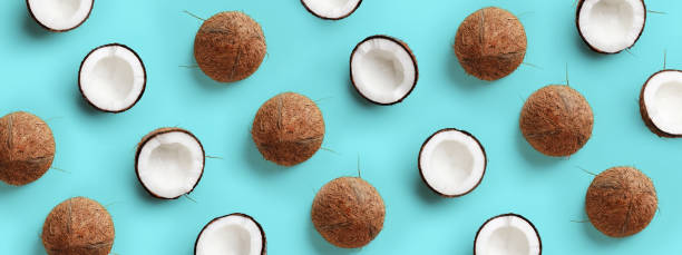 istock Coconut pattern on pastel blue background. Summer concept. Flat lay, top view 1153620290