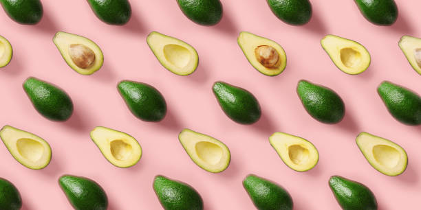 istock Avocado pattern on pink background. Pop art design, creative summer food concept. Green avocadoes, minimal flat lay style. Top view 1153620497