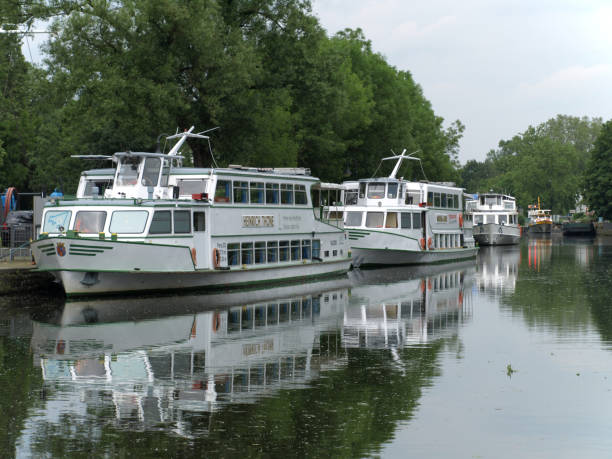 2019-06-03 Muelheim-NRW-Germany, tourist ships of the so-called "white fleet" (Weisse Flotte) on the river Ruhr 2019-06-03 Muelheim-NRW-Germany, tourist ships of the so-called "white fleet" (Weisse Flotte) on the river Ruhr flotte stock pictures, royalty-free photos & images