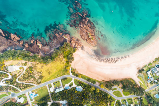 istock Looking down at houses next to beach. 1153625854
