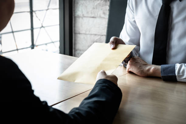 istock Business People With Bribe At Desk In Office 1153625988