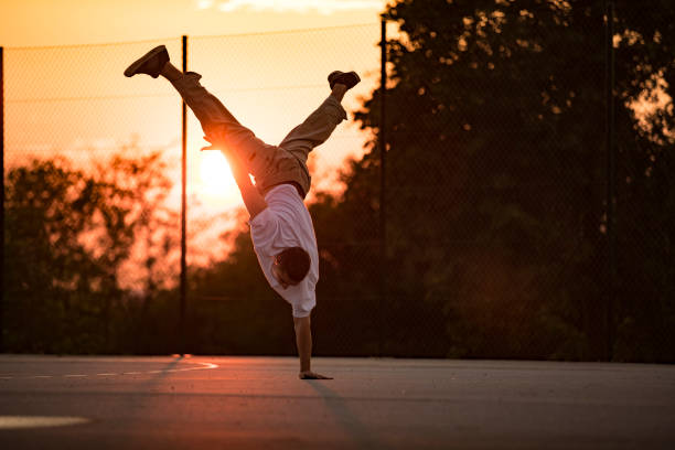 istock Young Adult Breakdancer Practicing Outdoors 1153626137