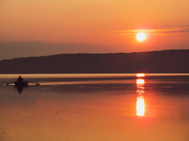 istock Fishing boat on lake. 1153627486