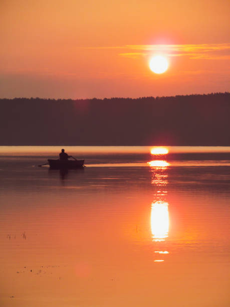 istock Fishing boat on lake. 1153627507