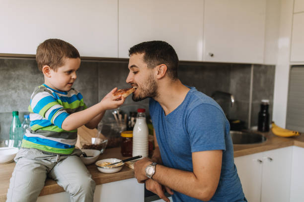 istock Father and son in the kitchen 1153633402