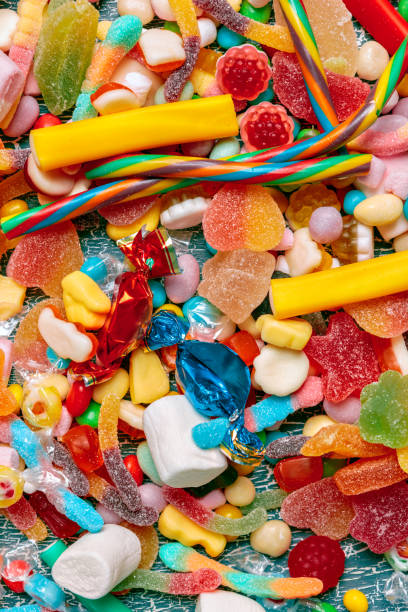 istock Colorful candies on old background 1153633482