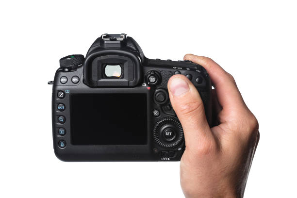 istock Photo camera in hand isolated on white background 1153633854