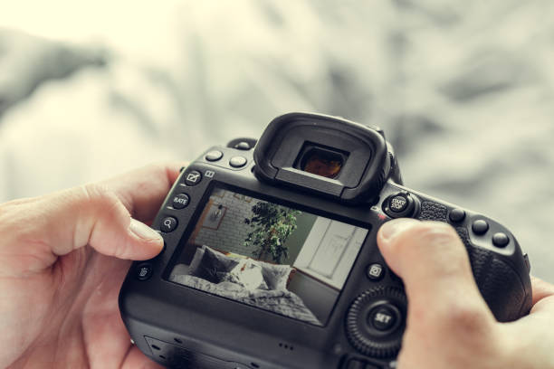 istock photographer with camera in hand 1153634947