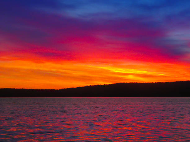 istock Bright colorful sunset over a lake. 1153635166