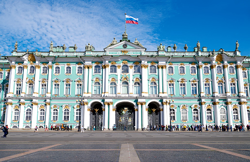 St. Petersburg, Russia - June 19, 2018: Low angle view of Winter Palace at sunny day, St. Petersburg, Russia. Winter Palace also known as State Hermitage Museum.