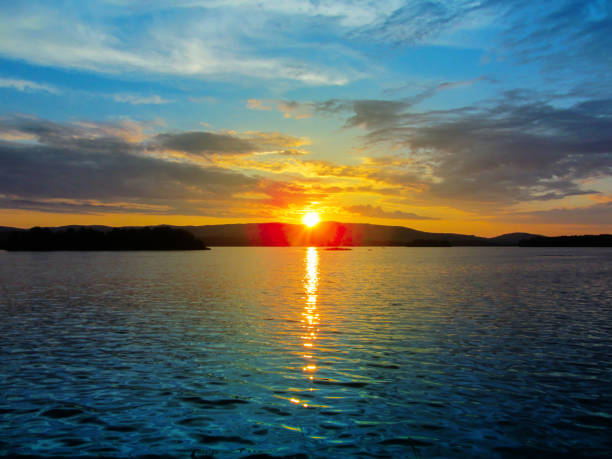 istock Bright colorful sunset over a lake. 1153635709