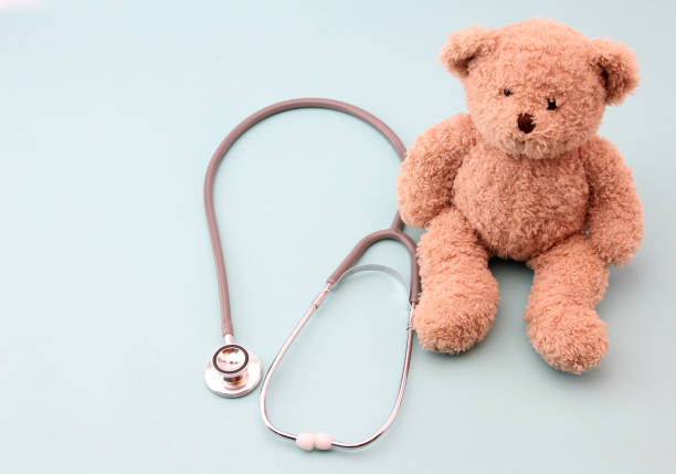 istock Teddy bears and medical equipment with a blue background. 1153637136