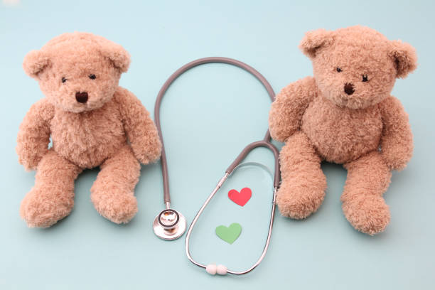 istock Teddy bears and medical equipment with a blue background. 1153637162
