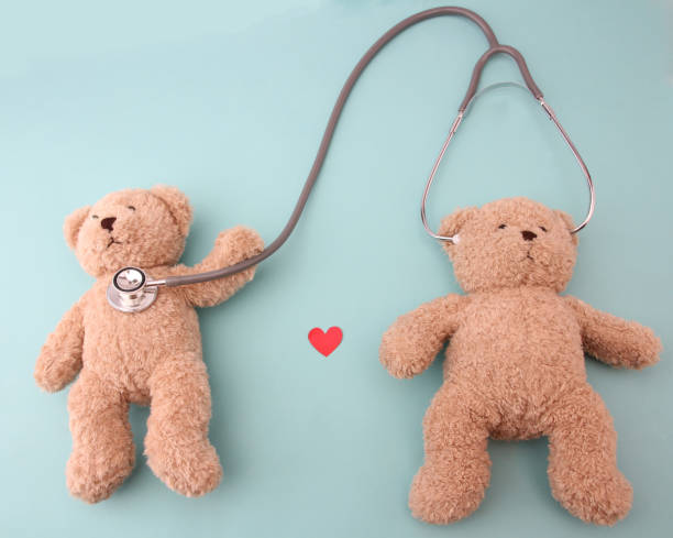istock Teddy bears and medical equipment with a blue background. 1153637169