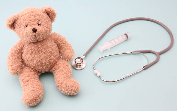 istock Teddy bears and medical equipment with a blue background. 1153637184
