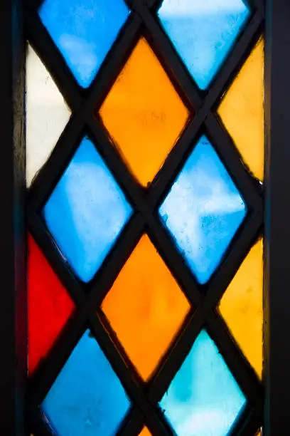 Closeup detail of the colorful stained glass window
