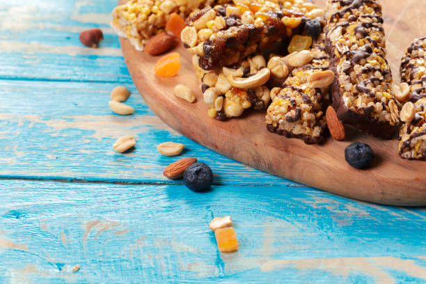 istock Granola bar on wooden background 1153638812