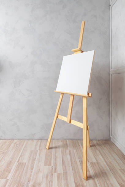 istock Wooden easel in the room 1153638926