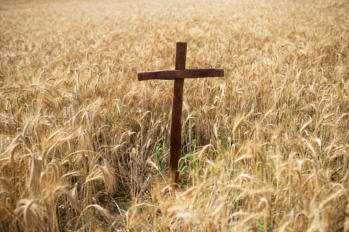 Religious cross symbol placed outside on the field