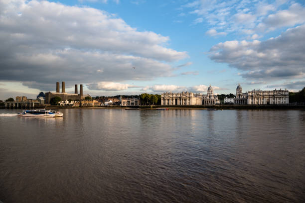 istock Thames River commuter ferry passing Greenwich riverfront buildings 1153641769