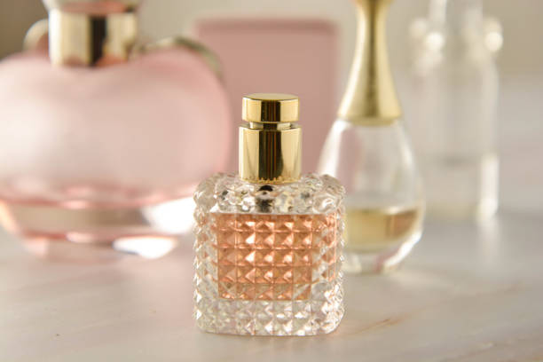 istock Beauty products. Perfume or parfume bottle on marble background. Copy space. 1153645198