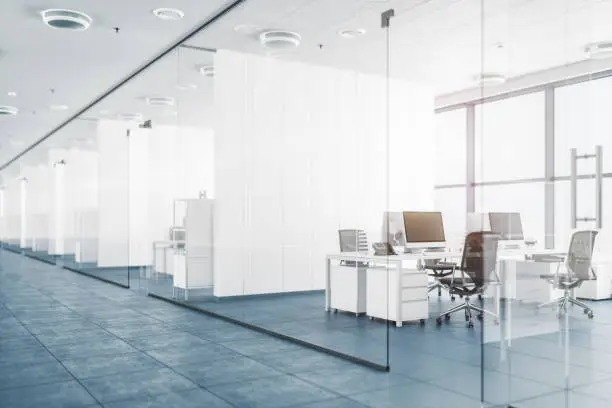 Modern empty office with glass partition walls.