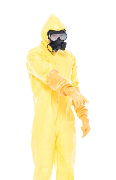 istock Man in protective clothing and pointing down 1153646999
