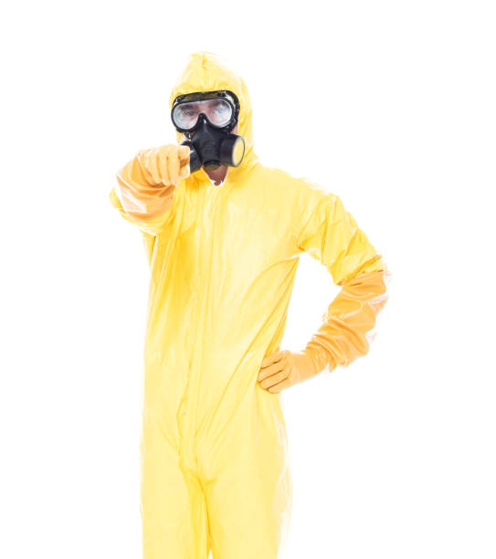 istock Man in protective clothing and pointing forward 1153647034
