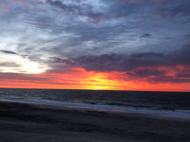 istock Sky on Fire: Sunrise in Point Pleasant Beach, NJ 1153647052
