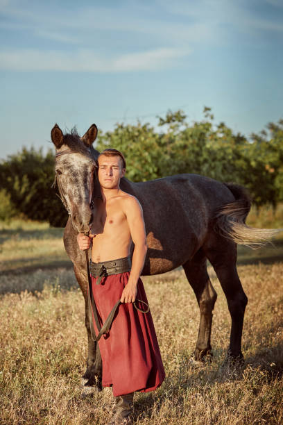 Cossack and his horse. Ukraine. Zaporozhye Sech. Cossack and his horse. Ukraine. Zaporozhye Sech. Traditional clothes of Cossack. cossack stock pictures, royalty-free photos & images