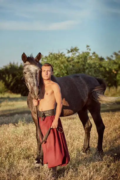 Cossack and his horse. Ukraine. Zaporozhye Sech. Traditional clothes of Cossack.