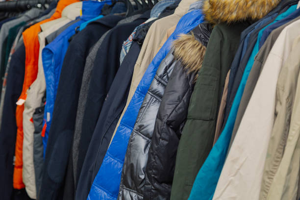 istock Beautiful colorful clothes in a store on hangers 1153647966